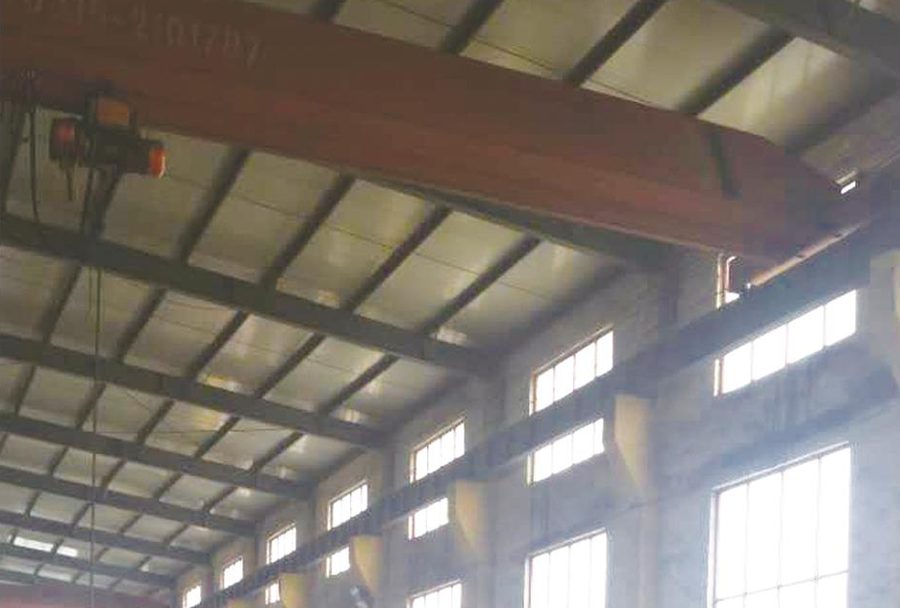 Steel tower fabrication workshop with CNC plasma cutting line and overhead cranes