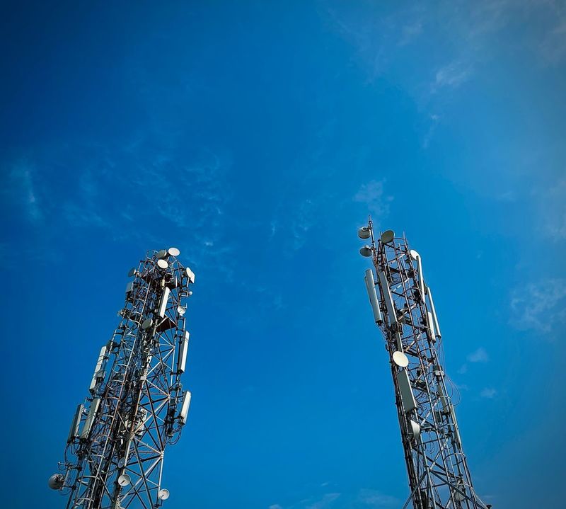 Telecom lattice tower with panel antennas and microwave dishes